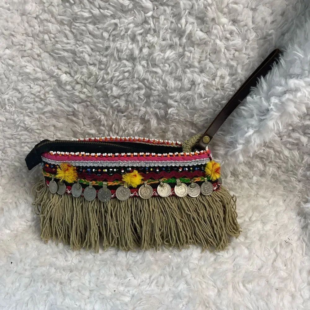 - Elliott Mann Indie multi color clutch with beads and coins accents.